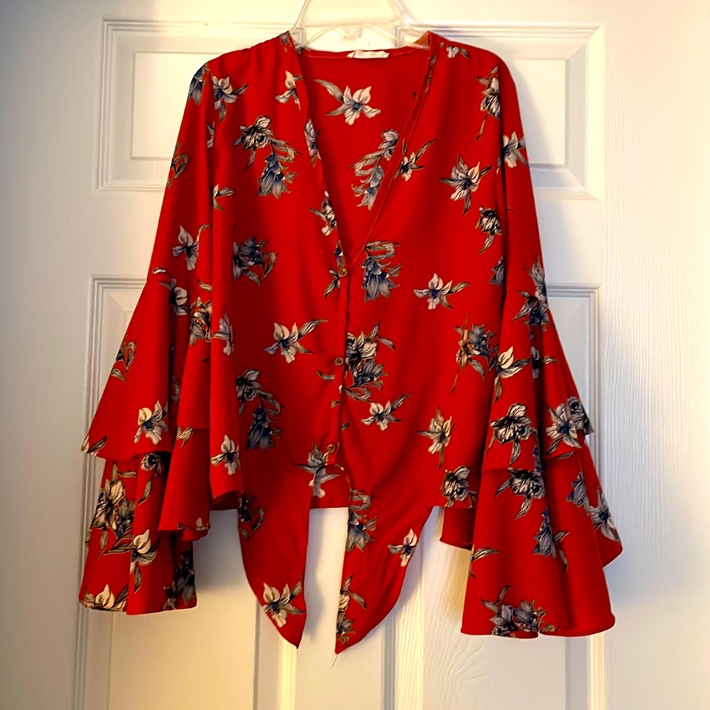 Rust floral blouse with tie. Low neck